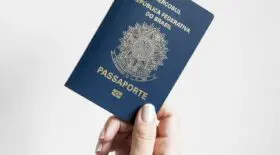 Traveler holding passport with SB-1 stamp