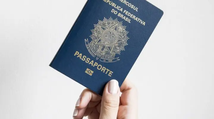 Traveler holding passport with SB-1 stamp