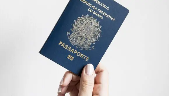 Traveler holding passport with SB-1 stamp