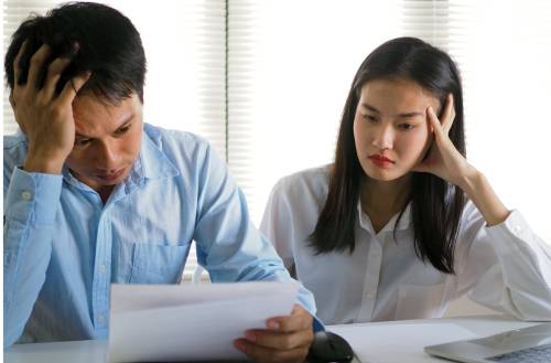Couple frustrated filling out Form I-824